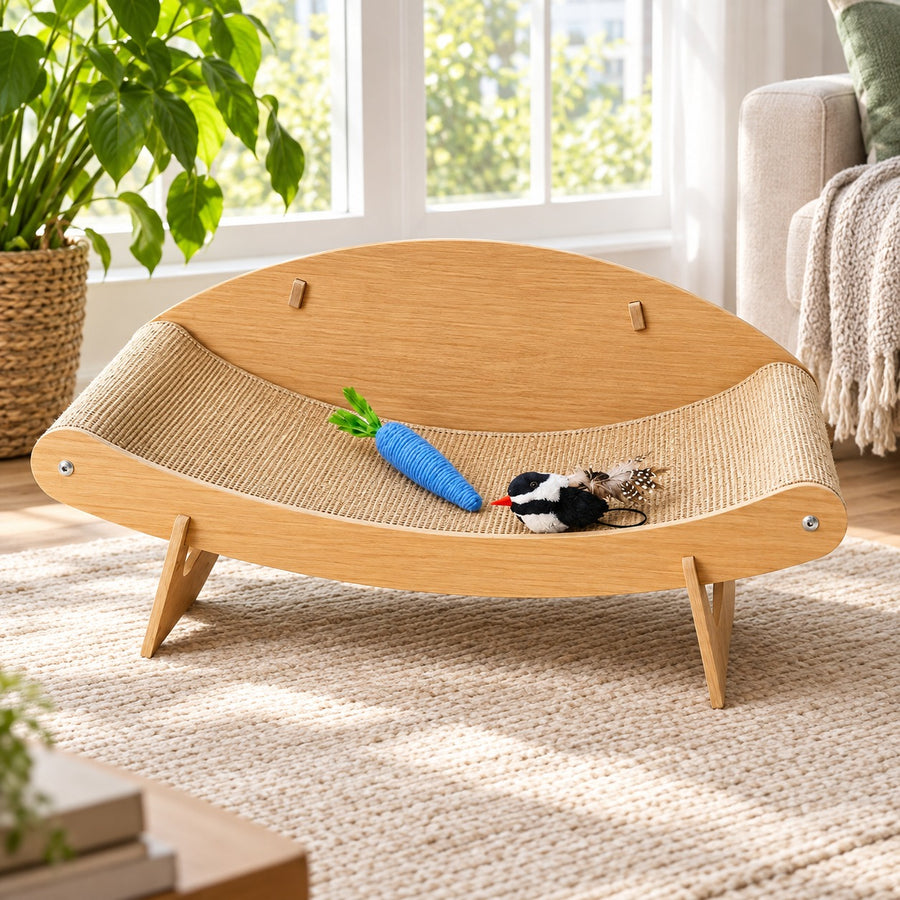 Curved sisal cat scratcher lounge bed on a solid wood frame with bird and carrot toys