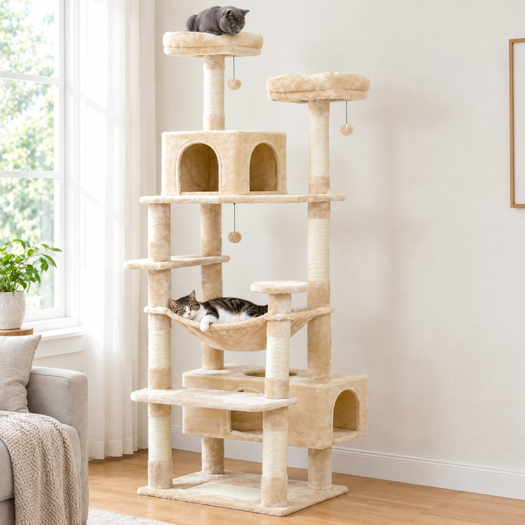 Cat lying in the hammock of a beige 72 in cat tree tower, another cat sitting on the top perch