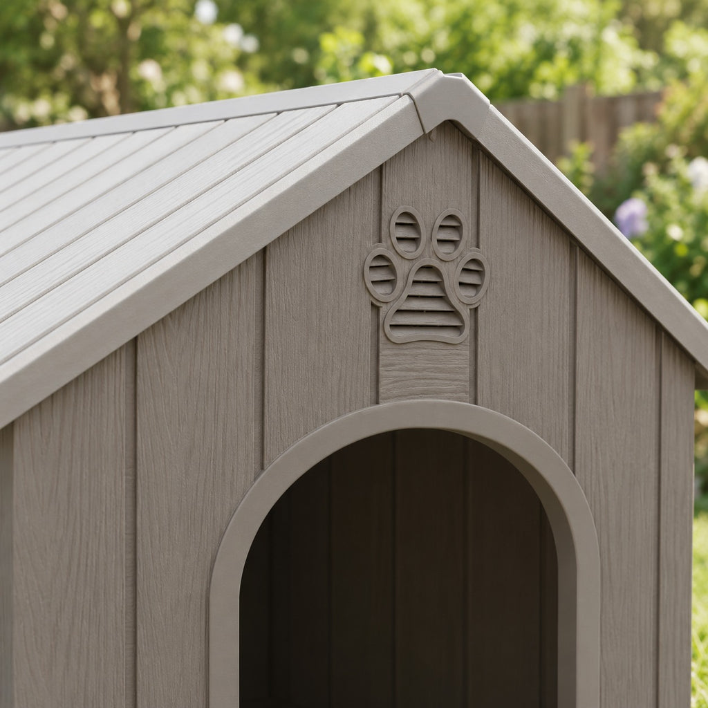 Paw-print vent and ribbed roof of the gray plastic dog house