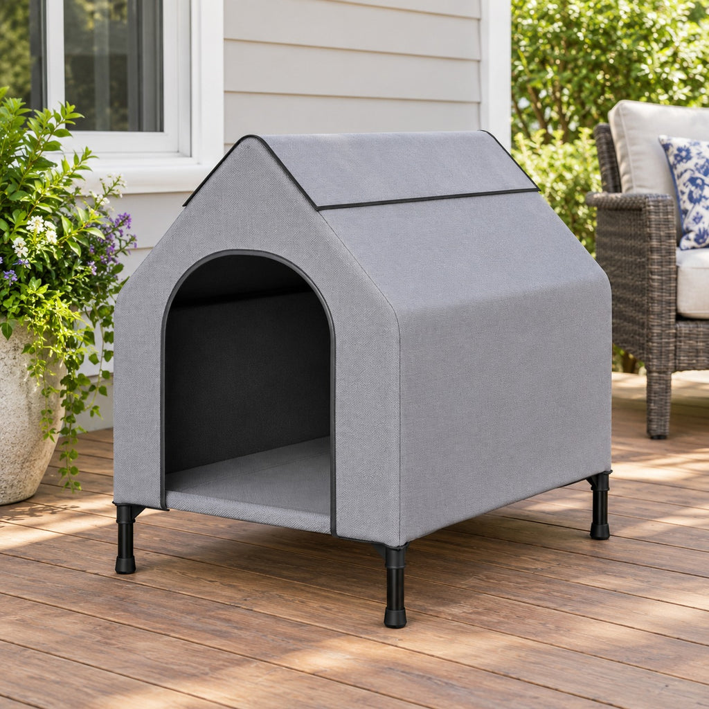 Elevated grey dog house with metal frame on a wooden patio
