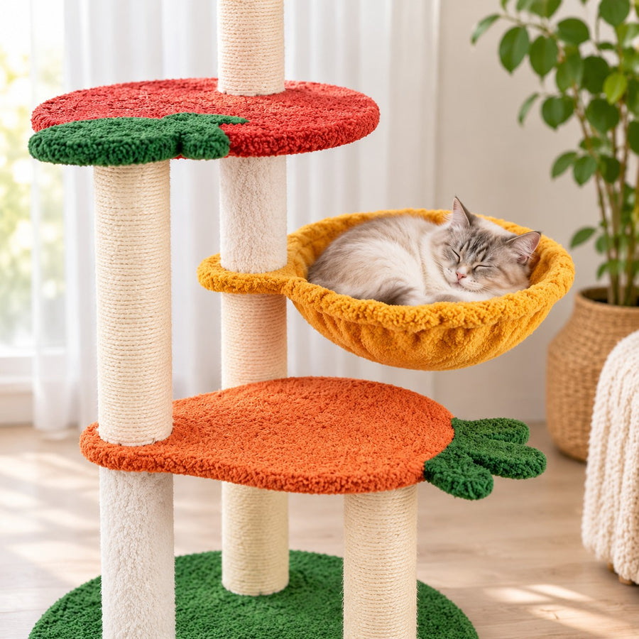 Cat curled up in the rotating yellow basket of the fruit cat tree