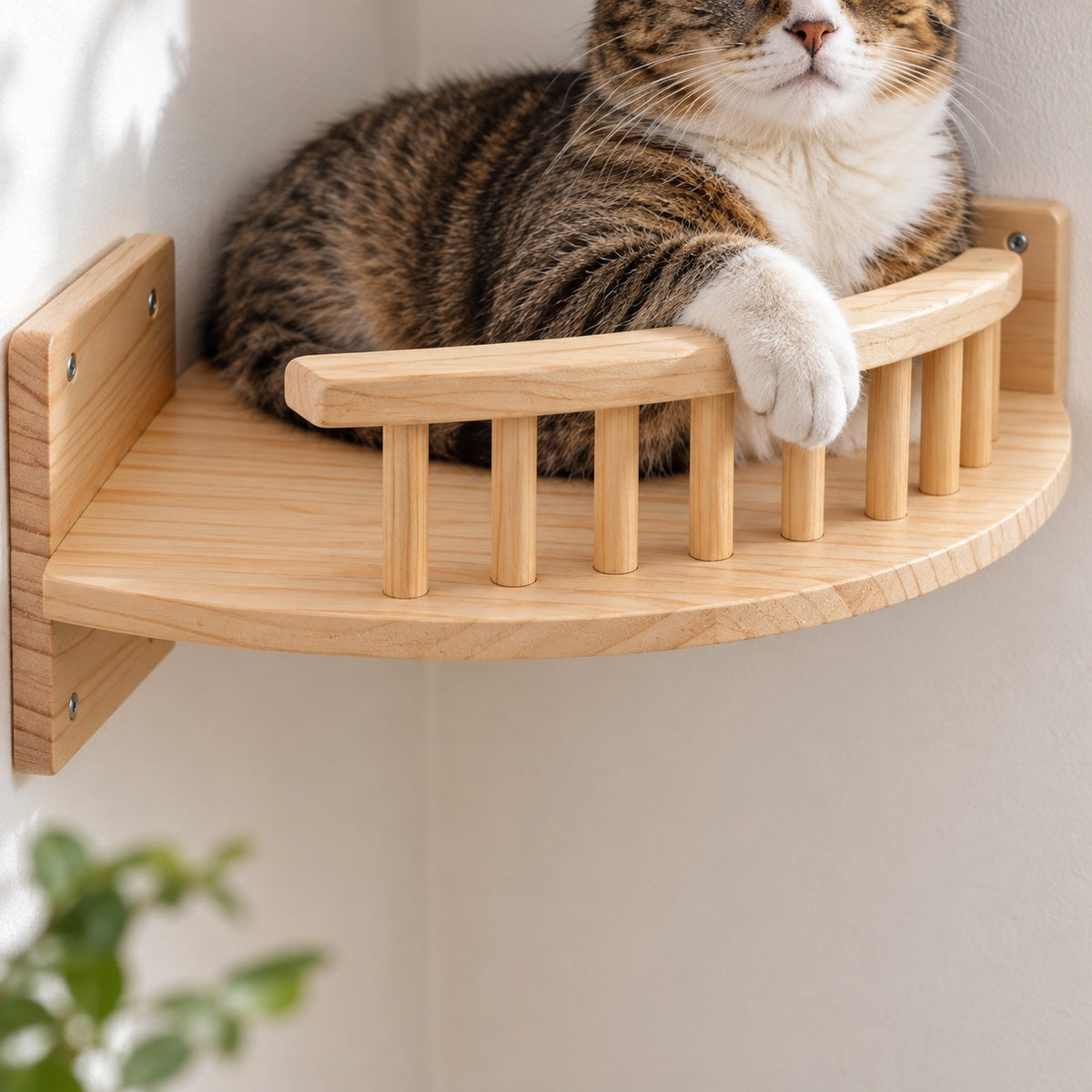 Spindle guard rail of the pine corner cat bed with a cat paw resting on it